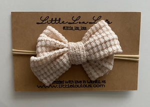 Cream sweater bow