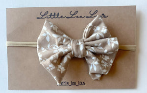 tan floral bow